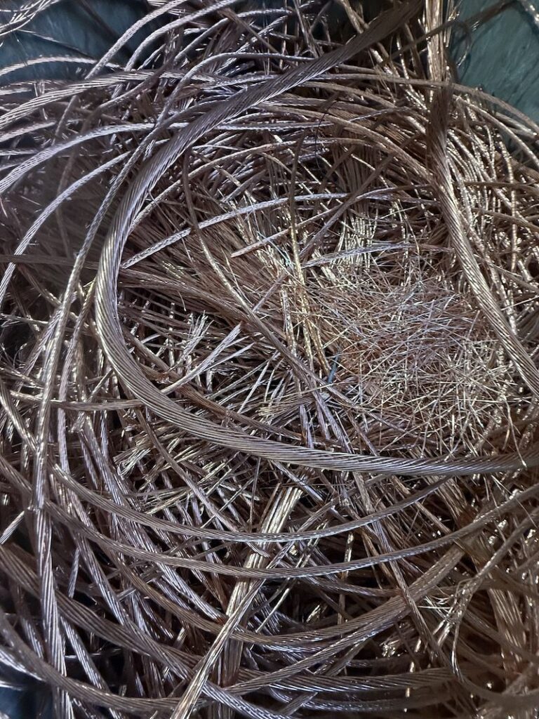 Coiled stripped copper wire ready to be weighed at Malaga Scrap Metal