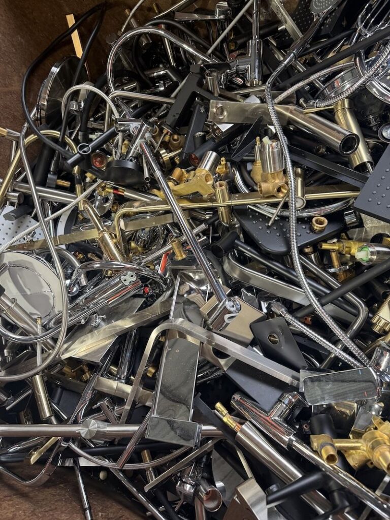 Mixed brass taps, spouts and bathroom fittings collected for brass recycling in Perth