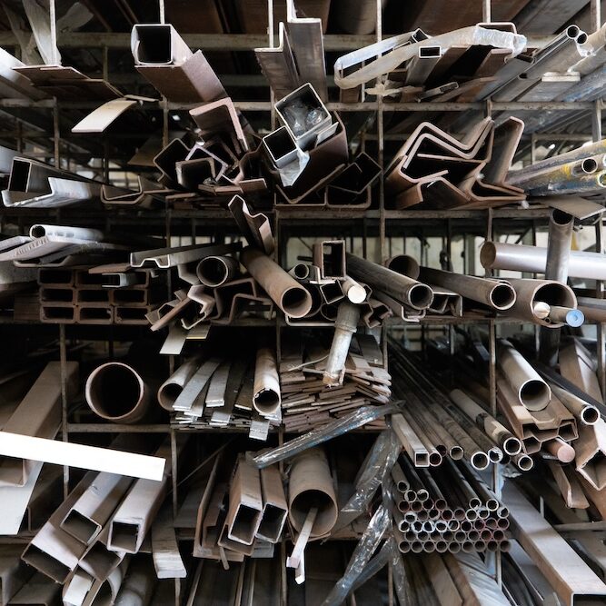 Steel materials, Aluminum metal sheet waste after machining , stainless steel rubbish , scrap metal pile junk yard waste, stacked together Prepare for recycle or reused. Environment concept